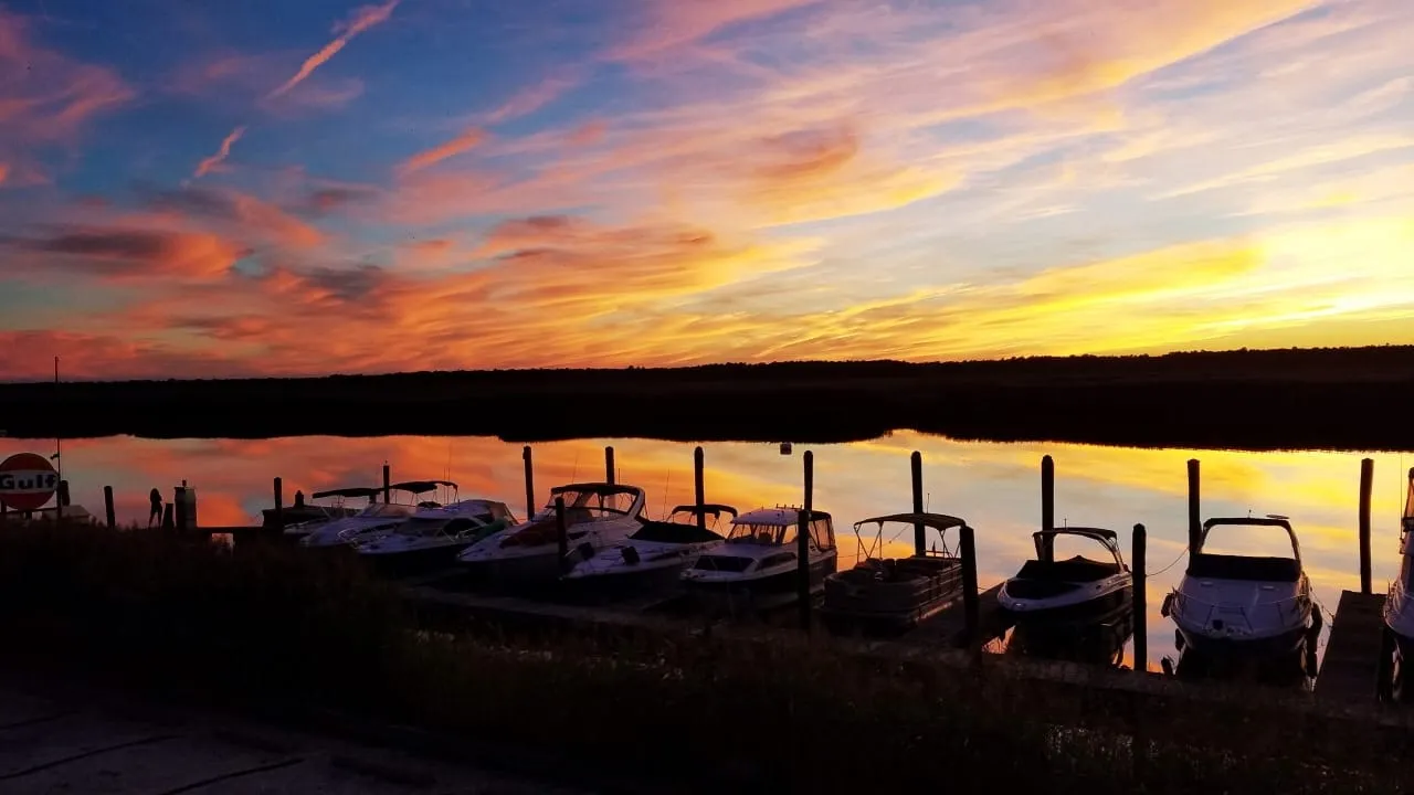 Boats docked at sunset at Shady River Marina near Somers Point NJ
